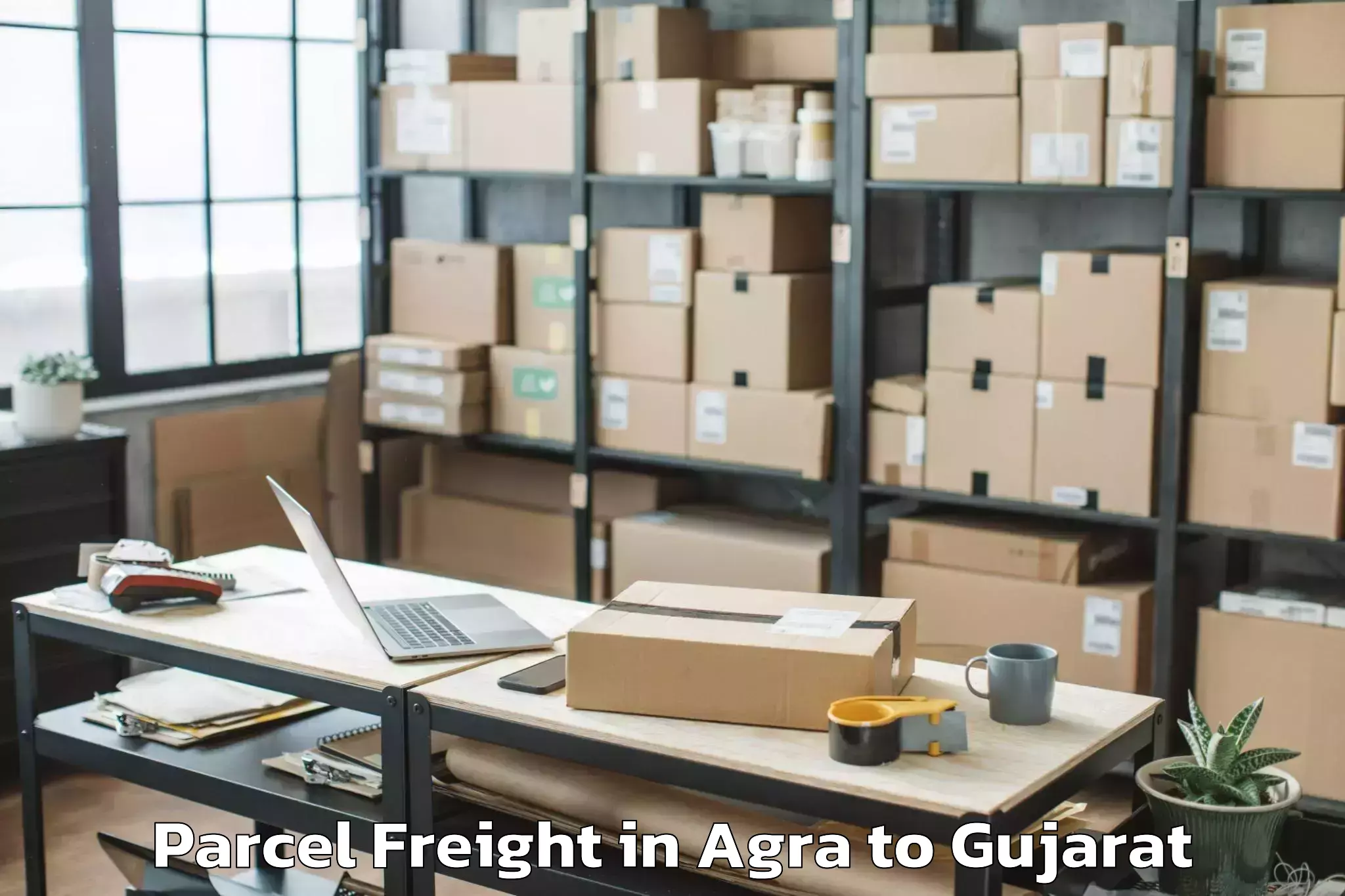 Book Your Agra to Olpad Parcel Freight Today